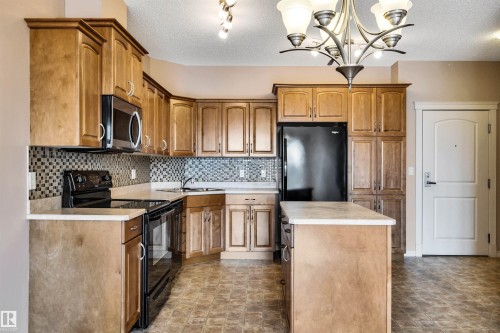 326 9820 165 Street, Edmonton, AB - Indoor Photo Showing Kitchen With Double Sink