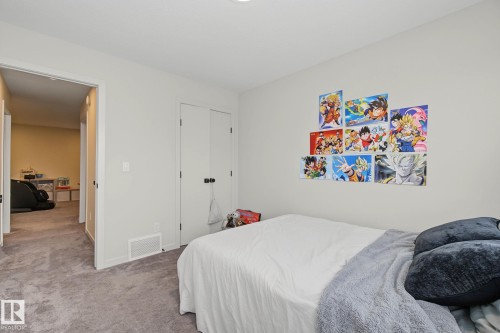 Carpeted room featuring light gray walls and a white bi-fold closet - 3313 Kulay Way, Edmonton, AB 