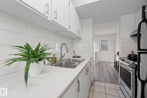 new counter tops - 661 Abbottsfield Road Nw, Edmonton, AB - Indoor Photo Showing Kitchen With Double Sink