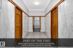 Hallway featuring marble wall panels, wood door frames, wood panel doors, crown molding, and terrazzo flooring - 