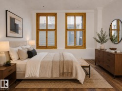 Virtually Staged-Warm wood-finish flooring complements the bright white walls and natural light from the two large windows - 