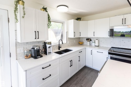 90 22111 Twp Rd 510, Rural Leduc County, AB - Indoor Photo Showing Kitchen With Double Sink