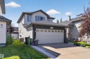 Two-story residence featuring light gray siding with dark trim accents and a contrasting roof - 2327 37B Avenue, Edmonton, AB 