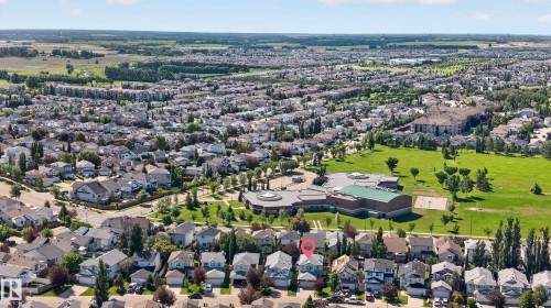Aerial perspective showcasing a residential neighborhood with surrounding green spaces and agricultural areas - 2327 37B Avenue, Edmonton, AB 