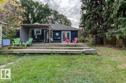 Expansive rear deck featuring multiple levels and a partial pergola - 