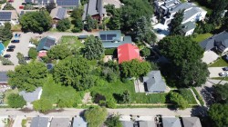 Expansive property featuring mature trees and established landscaping - 