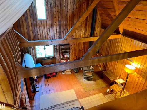 Vaulted wood-paneled ceilings with exposed wood beams - 208 60118 Secondary Highway 867, Rural St. Paul County, AB - Indoor Photo Showing Other Room