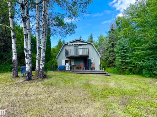 Barn-style cabin featuring a second-story balcony with railings - 208 60118 Secondary Highway 867, Rural St. Paul County, AB - Outdoor
