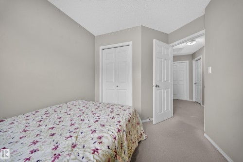 Light gray wall paint complemented by white trim and doors - 59 2503 24 Street, Edmonton, AB 