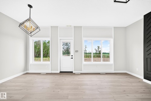 79 Patriot Way, Spruce Grove, AB - Indoor Photo Showing Other Room With Fireplace