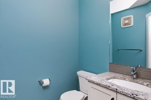 Vanity with a speckled countertop and undermount sink - 27 4205 30 Street, Edmonton, AB 