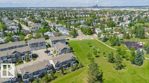 Aerial perspective showcasing a residential neighborhood with townhomes and detached properties - 27 4205 30 Street, Edmonton, AB 