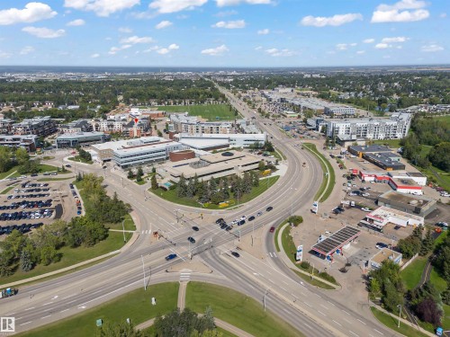 Aerial perspective showcasing an urban and suburban landscape with commercial and residential buildings - Sherwood Park, AB 