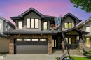 Modern two-story residence featuring a stone and stucco exterior - 1231 Tredger Crest, Edmonton, AB 
