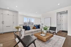 Bright living area featuring wood-finish flooring and a neutral color palette - 