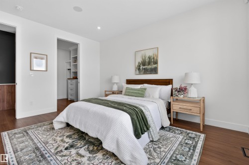 Bedroom featuring wood-finish flooring, white walls, and a recessed lighting system - 149 Eastgate Way, St. Albert, AB 