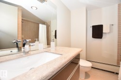 Vanity featuring an integrated rectangular sink, stone-finish countertop, and chrome faucet - 