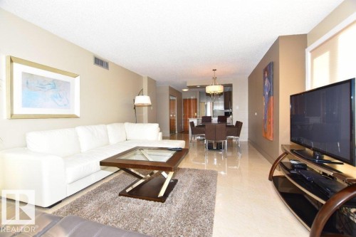 Open-concept living area featuring light-toned flooring throughout - 1805 10011 123 Street, Edmonton, AB 