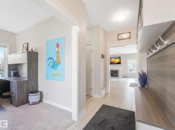 Convenient main-floor office with clear sightlines to the front approach, plus access that lets you enter and exit without stepping into the main living areas. - 