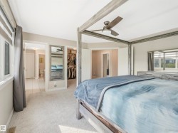 Separate his-and-hers walk-in closets for added convenience — one directly off the primary suite and the other accessed through the ensuite bathroom. - 