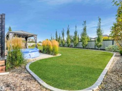 Meticulous attention to detail throughout this expansive backyard — including pre-wiring for a future hot tub. - 