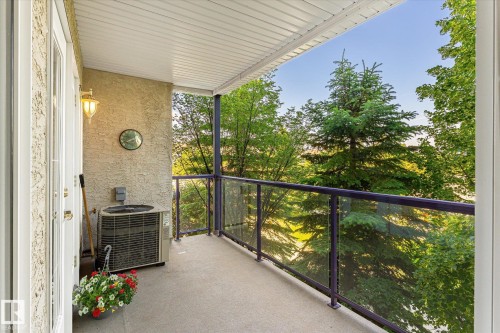 Private balcony with stucco exterior and concrete flooring - #310 237 Youville Dr E Nw, Edmonton, AB - Outdoor With Balcony With Exterior