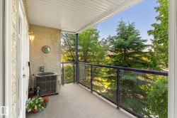 Private balcony with stucco exterior and concrete flooring - 