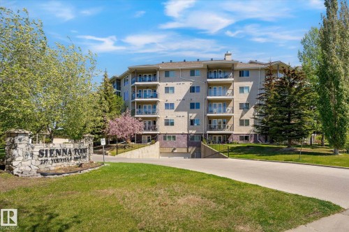 Multi-story residential building featuring exterior balconies with glass railings - #310 237 Youville Dr E Nw, Edmonton, AB - Outdoor With Balcony With Facade