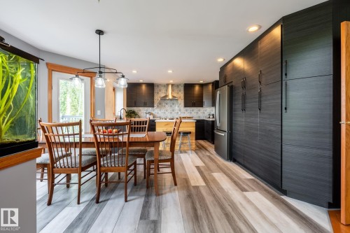 Open-concept dining space between the kitchen and living room - 114 Reichert Drive, Beaumont, AB 