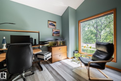 Main floor den includes french doors and a view of the 13th green across the street - 114 Reichert Drive, Beaumont, AB 