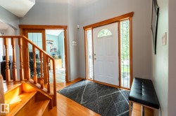 Hardwood flooring throughout the entryway, showing the entry to the den - 