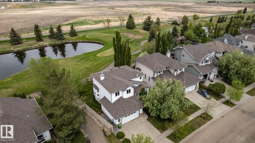 Aerial perspective showcasing this home between the 13th and 14th holes at Coloniale, with great views and privacy - 114 Reichert Drive, Beaumont, AB 