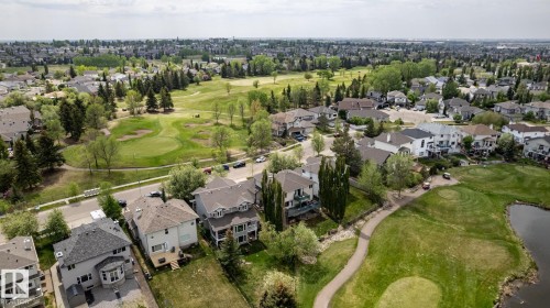 Residential properties bordered by mature trees and a golf course - a gorgeous setting for this exceptional executive home - 114 Reichert Drive, Beaumont, AB 