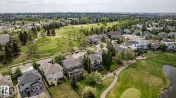 Residential properties bordered by mature trees and a golf course - a gorgeous setting for this exceptional executive home - 