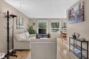 Bright living area featuring light wood-finish flooring - 31 Alpine Boulevard, St. Albert, AB 