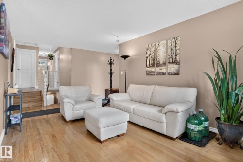 Hardwood-style flooring throughout the main level - 31 Alpine Boulevard, St. Albert, AB 