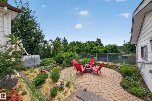 Circular paver patio with a built-in fire pit - 3411 103 Avenue, Edmonton, AB 