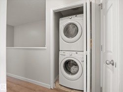 Stackable washer and dryer unit within a dedicated closet - 