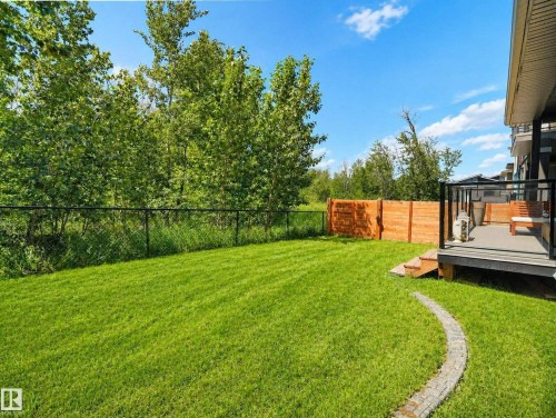 Expansive lawn area with a decorative stone border - 320 38 Street, Edmonton, AB 
