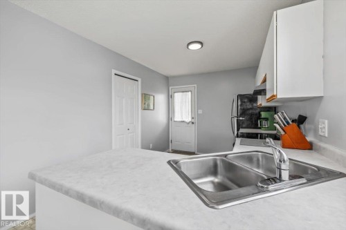 9916 93 Street, Fort Saskatchewan, AB - Indoor Photo Showing Kitchen With Double Sink
