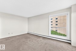 Expansive room featuring plush wall-to-wall carpeting and neutral wall tones - 