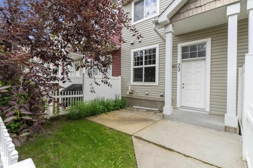 Exterior entrance featuring light-toned siding and white trim - 73 2051 Towne Centre Boulevard, Edmonton, AB 