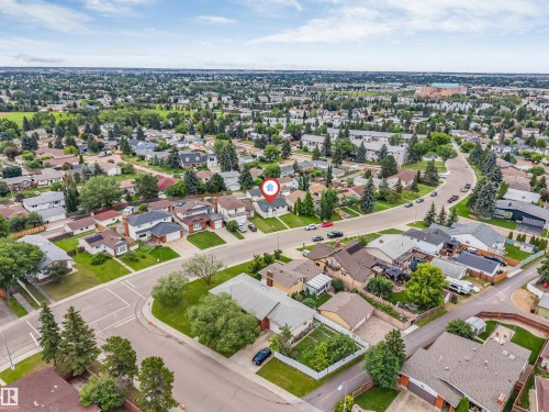 Residential neighborhood featuring a variety of housing styles, mature trees, and paved streets - 193 Woodvale Road W, Edmonton, AB 