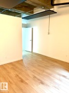 Light wood-finish flooring extending throughout the space - 