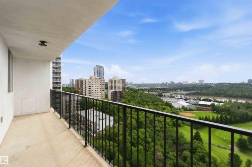 Balcony featuring a black wrought iron railing, concrete flooring, and a flush-mount ceiling light - 1008 11307 99 Avenue, Edmonton, AB 