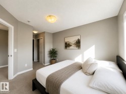 Room featuring a neutral color palette, carpeted flooring, and a flush-mount ceiling light - 