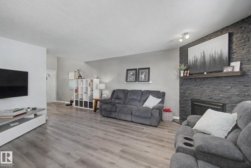 172 Galloway Wynd, Fort Saskatchewan, AB - Indoor Photo Showing Living Room With Fireplace