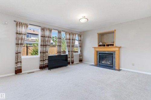 1710 Hodgson Place, Edmonton, AB - Indoor Photo Showing Living Room With Fireplace