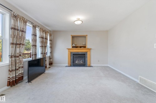 1710 Hodgson Place, Edmonton, AB - Indoor Photo Showing Living Room With Fireplace