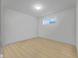 Neutral wall tones complement the wood-finish flooring - 